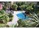 Community pool with surrounding landscaping and lounge chairs at 504 S Armenia Ave # 1323, Tampa, FL 33609