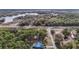 Aerial view of a blue house with a large lot near a river at 5250 Little Green Ln, Dade City, FL 33523