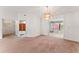 Open dining room with carpeted floors at 5250 Little Green Ln, Dade City, FL 33523