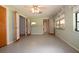 Bright dining room with ceiling fan, multiple windows, and easy access to other rooms at 5250 Little Green Ln, Dade City, FL 33523