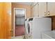 Laundry room with modern washer and dryer at 5250 Little Green Ln, Dade City, FL 33523