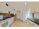 Efficient kitchen featuring white cabinets and dark countertops at 5551 5Th N Ave, St Petersburg, FL 33710