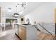 Kitchen island with marble countertop, black faucet, and wood paneling at 6462 92Nd N Pl # 802, Pinellas Park, FL 33782