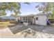 Home's backyard, featuring a screened patio and ample space at 7235 12Th N Ave, St Petersburg, FL 33710