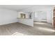 Spacious living area with new floors, white walls, and a flexible layout perfect for entertaining at 7235 12Th N Ave, St Petersburg, FL 33710