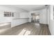 Open living space featuring new floors, white walls, and sliding glass doors providing a seamless indoor-outdoor flow at 7235 12Th N Ave, St Petersburg, FL 33710