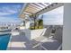 Spacious rooftop terrace with lounge chairs and pergola at 777 3Rd N Ave # 1206, St Petersburg, FL 33701