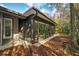 Bright sunroom addition with large windows and backyard access at 873 Lucas Ln, Oldsmar, FL 34677