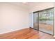 Bright bedroom with sliding door and a ceiling fan at 8737 Bardmoor Pl # 101, Seminole, FL 33777