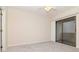 Bedroom with ceiling fan, carpet, and sliding glass doors leading to the outside at 8737 Bardmoor Pl # 101, Seminole, FL 33777