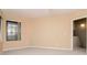 Bright bedroom with neutral walls, carpeted floors, and a large window providing natural light at 8737 Bardmoor Pl # 101, Seminole, FL 33777
