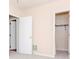 Bedroom with adjoining doors to additional bedroom and closet at 8737 Bardmoor Pl # 101, Seminole, FL 33777