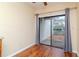 Dining area featuring wood floors and sliding glass doors with access to the outdoors at 8737 Bardmoor Pl # 101, Seminole, FL 33777