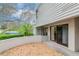 Exterior of condo unit with private entrance, enclosed courtyard, and landscaped surroundings at 8737 Bardmoor Pl # 101, Seminole, FL 33777