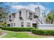 Condo complex exterior view, showcasing a well-maintained building and landscaping at 8737 Bardmoor Pl # 101, Seminole, FL 33777