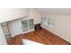 Spacious living room with hardwood floors, fireplace and plenty of natural light at 8737 Bardmoor Pl # 101, Seminole, FL 33777