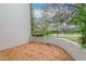 Private patio area with mature trees at 8737 Bardmoor Pl # 101, Seminole, FL 33777