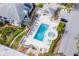 Aerial view of community pool, spa, lounge chairs, and a covered cabana at 8737 Bardmoor Pl # 101, Seminole, FL 33777