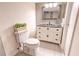 Bathroom featuring a framed mirror, granite counters, tiled floors, modern fixtures, and decor at 9100 Dr Martin Luther King Jr N St # 1706, St Petersburg, FL 33702