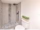Updated bathroom with tiled shower featuring decorative mosaic, modern fixtures, and clean design at 9100 Dr Martin Luther King Jr N St # 1706, St Petersburg, FL 33702