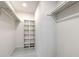 Walk-in closet with built-in shelving for organized storage solutions, maximizing space and functionality at 9100 Dr Martin Luther King Jr N St # 1706, St Petersburg, FL 33702