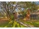 Inviting two-story condo building featuring brick accents, outdoor stairs, and verdant landscaping at 9100 Dr Martin Luther King Jr N St # 1706, St Petersburg, FL 33702
