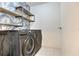 Laundry room featuring stainless steel Samsung washer and dryer and decorative shelving at 9100 Dr Martin Luther King Jr N St # 1706, St Petersburg, FL 33702