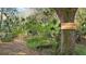 Entrance to Maple Park nature preserve with marked signage and a trail leading through lush vegetation at 9100 Dr Martin Luther King Jr N St # 1706, St Petersburg, FL 33702