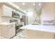 Modern kitchen with white cabinets, stainless steel appliances, and white countertops at 9100 Dr Martin Luther King Jr N St # 1706, St Petersburg, FL 33702