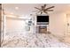 Living room with fireplace, TV, ceiling fan, and marble tile flooring at 9100 Dr Martin Luther King Jr N St # 1706, St Petersburg, FL 33702