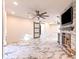 Living room with a ceiling fan, fireplace, and sliding barn door at 9100 Dr Martin Luther King Jr N St # 1706, St Petersburg, FL 33702