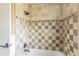 Tiled shower and bathtub combination in bathroom at 945 Bayshore Dr, Tarpon Springs, FL 34689