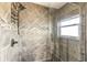 Bathroom features tiled shower and glass door at 945 Bayshore Dr, Tarpon Springs, FL 34689