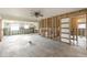 Spacious room with block walls, a view to kitchen, and doorway at 945 Bayshore Dr, Tarpon Springs, FL 34689