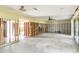 Large living room undergoing renovation with exposed walls and concrete flooring at 945 Bayshore Dr, Tarpon Springs, FL 34689