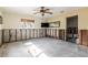 Spacious room features block walls, ceiling fan, window and doorway at 945 Bayshore Dr, Tarpon Springs, FL 34689