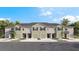 Beautiful townhomes with garages, landscaping, and palm trees at 1148 Great Ibis Dr, Ruskin, FL 33570