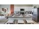 Modern kitchen with stainless steel appliances, island, and seating at 1148 Great Ibis Dr, Ruskin, FL 33570