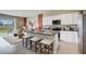 Modern kitchen with white cabinets, stainless steel appliances, and an island at 1148 Great Ibis Dr, Ruskin, FL 33570