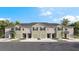 Attractive townhomes with garages, landscaping, and palm trees at 1150 Great Ibis Dr, Ruskin, FL 33570