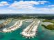 Aerial view of waterfront community with numerous homes and boats at 127 Boca Ciega Point N Blvd, St Petersburg, FL 33708