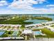 Community overview featuring pool, tennis courts, and waterway at 127 Boca Ciega Point N Blvd, St Petersburg, FL 33708