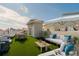 Spacious roof deck features outdoor seating, a lounge area, and views of the surrounding cityscape at 140 Brightwater Dr # 6, Clearwater Beach, FL 33767