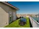 Waterfront roof deck offers panoramic views, dining seating, and white metal railings at 140 Brightwater Dr # 6, Clearwater Beach, FL 33767