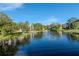 Tranquil community lake with a central fountain at 14130 Rosemary Ln # 5301, Largo, FL 33774