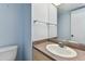 Clean bathroom with a single sink vanity and tile flooring at 1655 S Highland Ave # D140, Clearwater, FL 33756