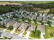 Aerial view of a neighborhood with houses and a golf course at 17766 Garsalaso Cir, Brooksville, FL 34604