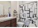 Clean bathroom with shower/tub combo and wood vanity at 17766 Garsalaso Cir, Brooksville, FL 34604