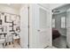 Bathroom with shower, linen closet, and view of bedroom at 17766 Garsalaso Cir, Brooksville, FL 34604