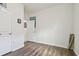 Empty bedroom featuring wood floors and an open door at 17766 Garsalaso Cir, Brooksville, FL 34604